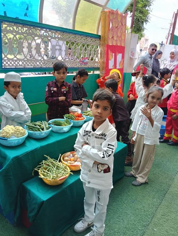 Nursery children running a green grocer stall in a role-play activity