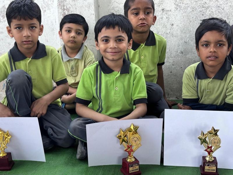 Young students with their prize trophies